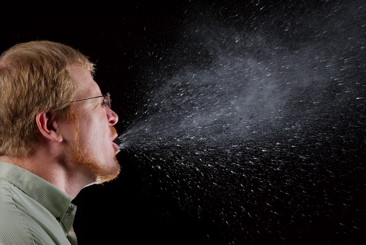 This 2009 photograph captured a sneeze in progress, revealing the plume of salivary droplets as they are expelled in a large cone-shaped array from this man’s open mouth, thereby, dramatically illustrating the reason one needs to cover hios/her mouth when coughing, or sneezing, in order to protect others from germ exposure. How Germs SpreadIllnesses like the flu (influenza) and colds are caused by viruses that infect the nose, throat, and lungs. The flu and colds usually spread from person to person when an infected person coughs or sneezes.How to Help Stop the Spread of GermsTake care to: - Cover your mouth and nose when you sneeze or cough - Clean your hands often - Avoid touching your eyes, nose or mouth - Stay home when you are sick and check with a health care provider when needed - Practice other good health habits.